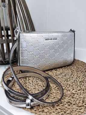 NWT. Michael Kors Jet Set metallic silver crossbody bag